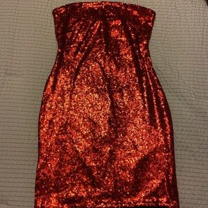 Red sequined body con dress